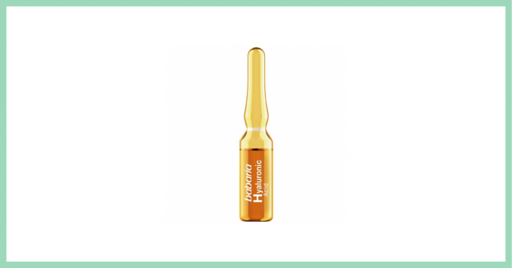 ampolla cosmética para el rostro en un pequeño recipiente de cristal color amarillo con etiqueta naranja de la marca Babaria